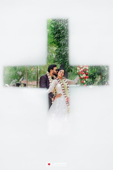 Bride and groom in wedding attire with flower garlands, posing outdoors and smiling, framed by a white cross-shaped overlay.